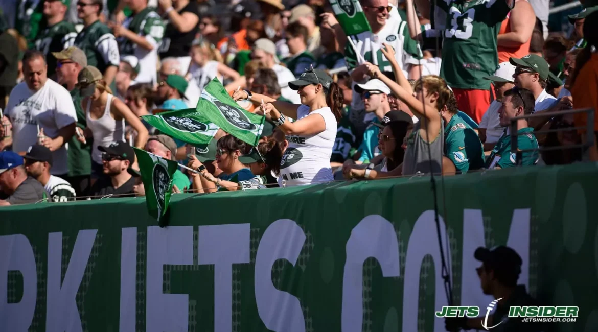 Fans of the NY Jets in the stands cheering