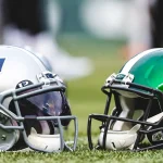 New England Patriot and NY Jets helmets set on the ground